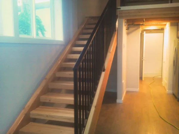 Open-Tread Beam Staircase - Image 2 by Cabe Construction, LLC